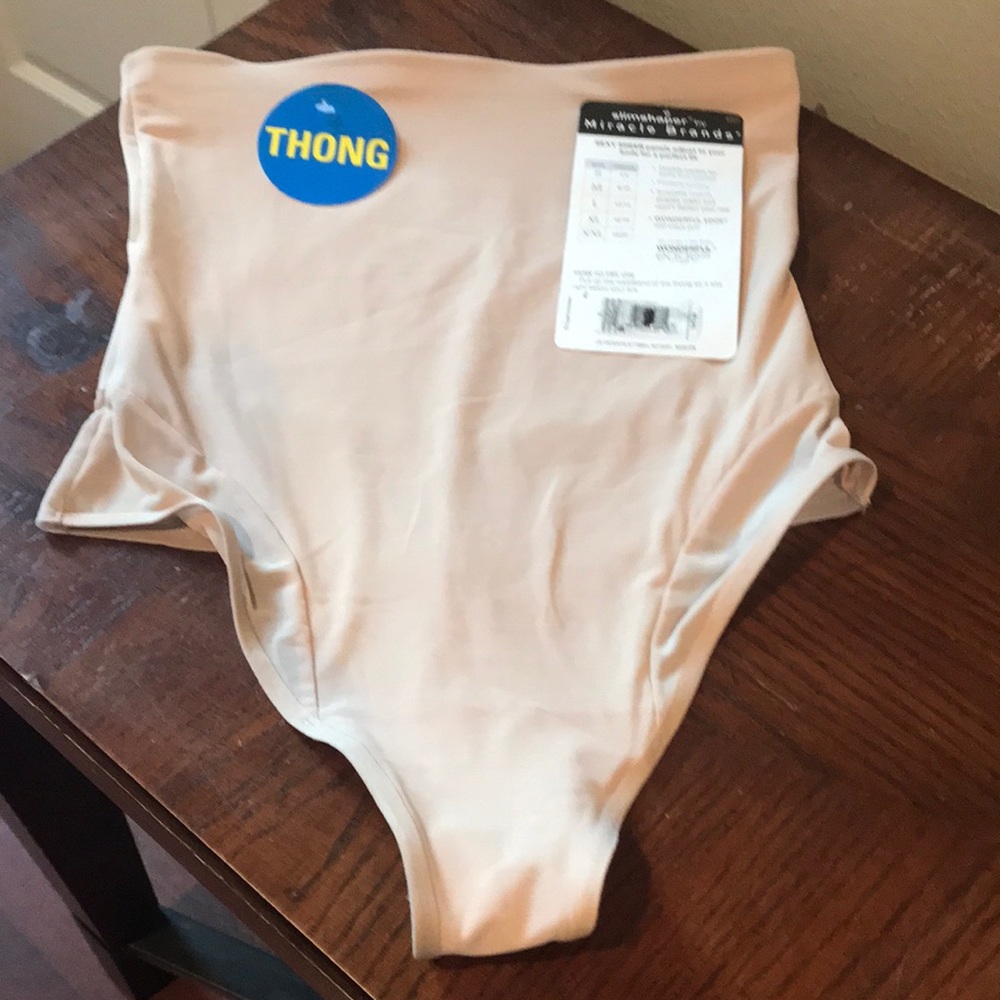 New women miracles brands size X-Large ( needs wash has spot ( makeup)